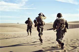 Soldiers Running In Desert Sand
