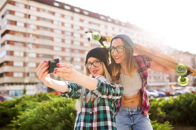 Hipster Girlfriends Taking Selfie