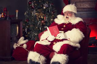 Santa Claus Reading Christmas Card