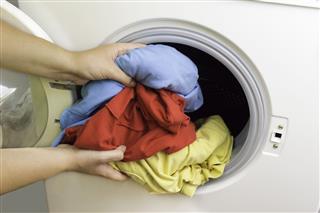 Putting Cloths In Washing Machine