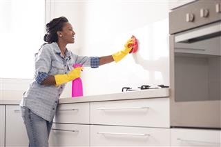 Woman Cleaning The Kitchen