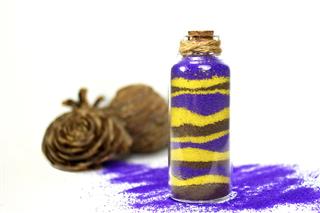 Purple And Yellow Sand In Bottle