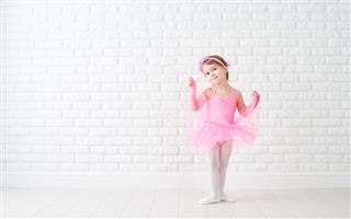 Little Child Girl Dreams Of Becoming Ballerina