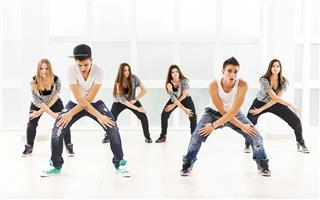 Large Group Of Teenagers Practicing Modern Dancing