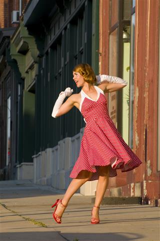 Woman Dancing Happily In The Street