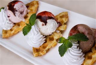 Ice Cream With Syrup And Waffles