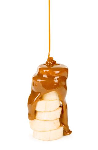 Caramel Is Poured On A Banana