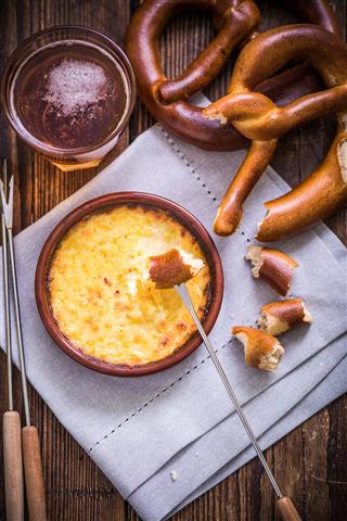 Worming Cheese Fondue With Pretzel