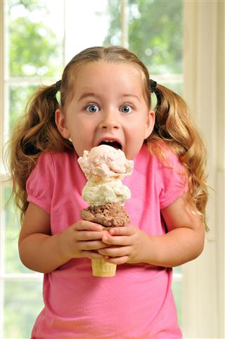 Girl Eating Triple Decker Ice Cream