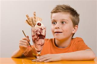 Boy Looking At Ice Cream Sundae