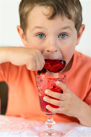 Boy Enjoying Red Jelly