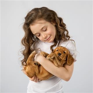 Little Girl With Puppy Isolated