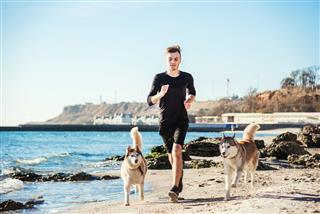 Running Man With Husky Dog