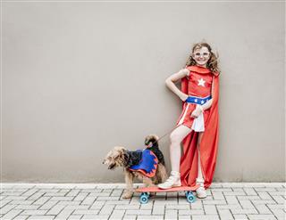 Little Superhero Girl With Her Dog