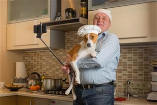 Man Doing Selfie With Basenji Dog