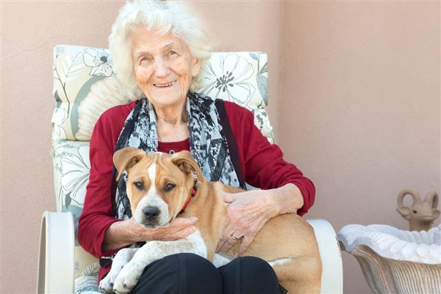 Senior Woman With Puppy