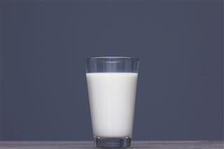 Glass Of Milk On Wooden Table