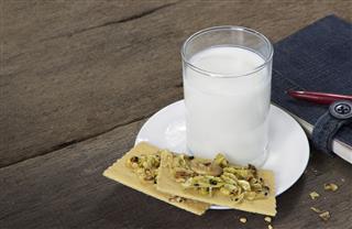 Glass Of Milk On Wooden Table