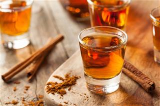 Cinnamon Whiskey Bourbon In Shot Glass
