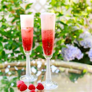 Cocktail With Champagne And Fresh Raspberries