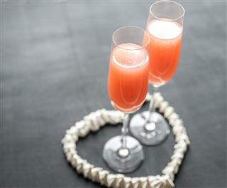 Two Bellini Cocktails Inside Of Meringue Heart