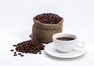 Coffee Beans In Bag And Coffee Cup