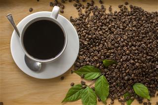 Coffee And Beans With Leaves