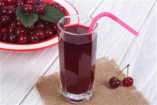 Glass Cherry Juice With Ripe Cherries