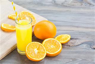 Orange Juice On Wooden Desk