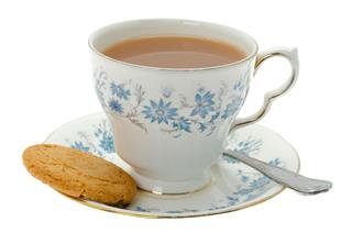 Cup Of Tea With A Cookie Biscuit