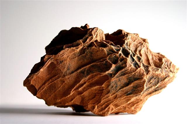 Jagged Isolated Piece Of Brown Rock