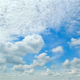 Blue Sky And Cumulus Clouds