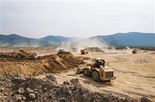 Bulldozers Digging Soil