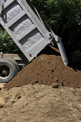 Dump Truck With Loam Pile
