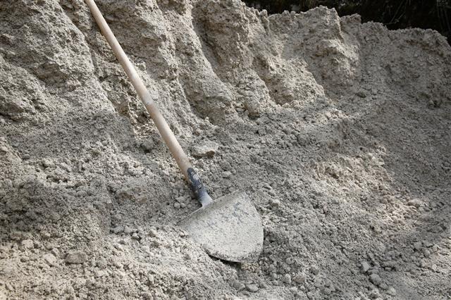 Shovel Lying On Pile Of Sand