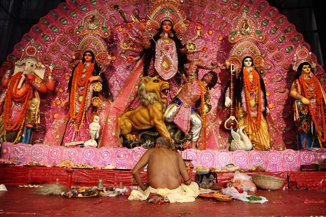 Hindu Priest Offers Puja Rituals