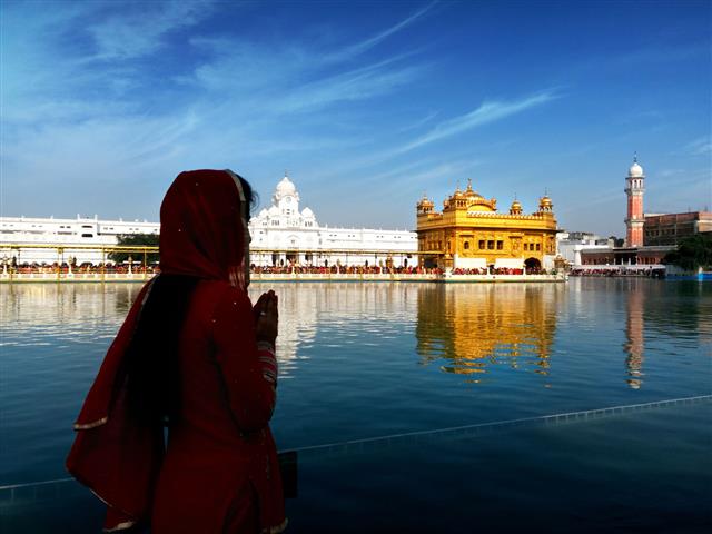 Praying To God In Golden Temple
