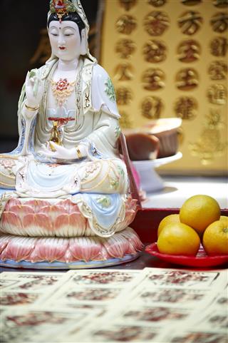 Guan Yin Statue With Ghost Money