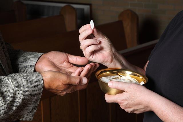 Hands Giving Communion