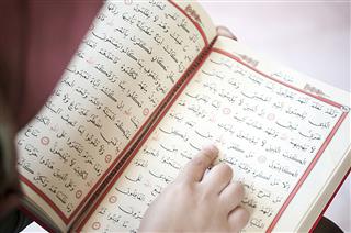 Woman Reading The Holy Quran