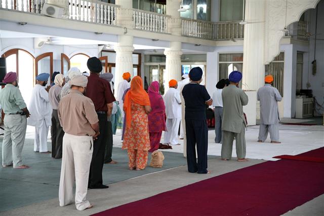People Praying In Sikh Temple
