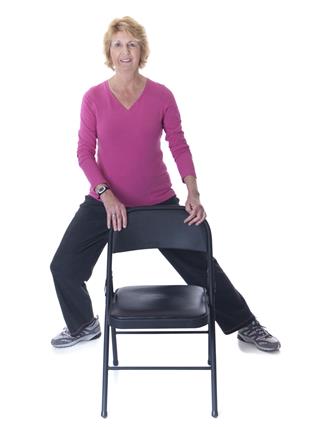Senior Woman Stretch Exercise With Chair