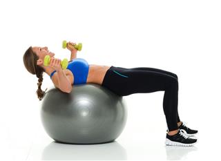 Smiling Sports Woman Exercising With Dumbbells