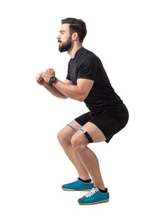 Young Athlete Squatting Exercise