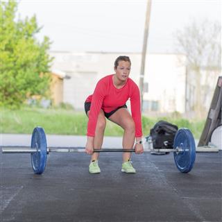 Fitness Woman Trains Deadlift At Gym