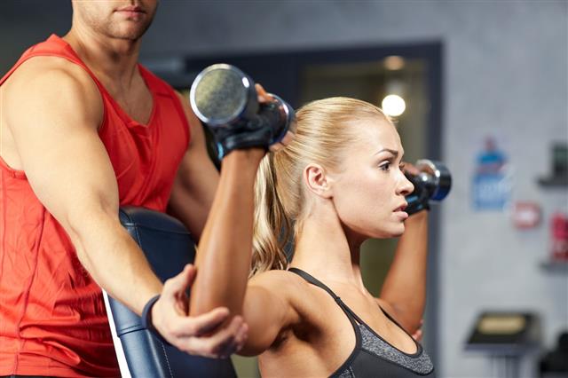 Man And Woman With Dumbbells