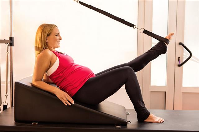 Pregnant Woman Stretching Her Leg