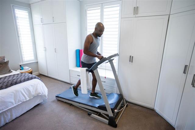 Man Exercising On Treadmill
