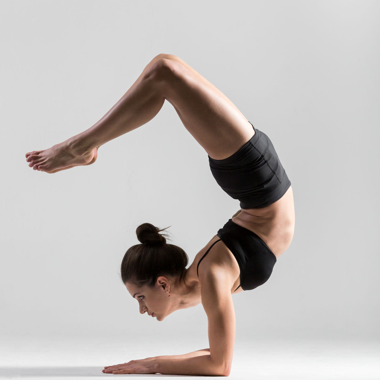 1280-533048153-yoga-girl-performs-scorpion-pose.jpg