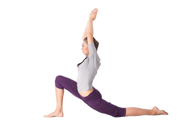 Young Woman Doing Yoga Exercise